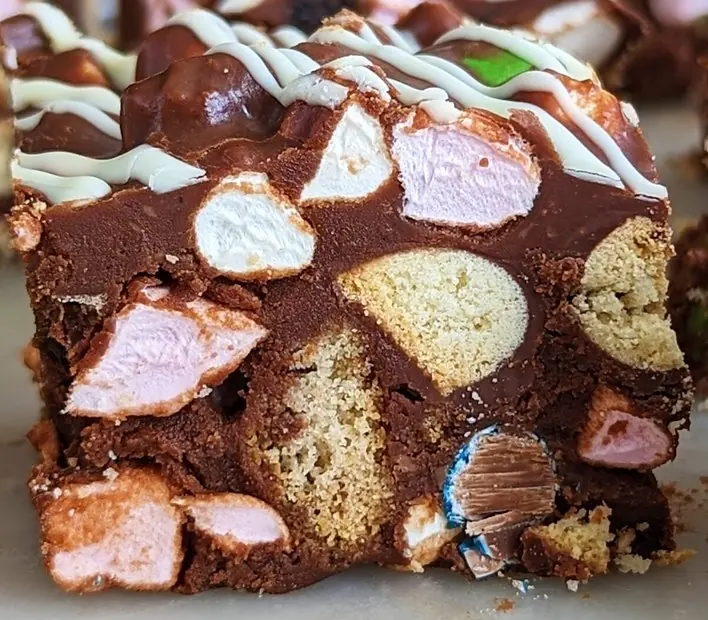 Rocky road square with marshmallows, biscuit and a white chocolate drizzle